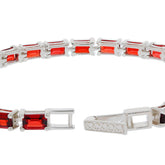 Sterling silver bracelet featuring emerald-cut red garnet gemstones, showcasing elegance and luxury.